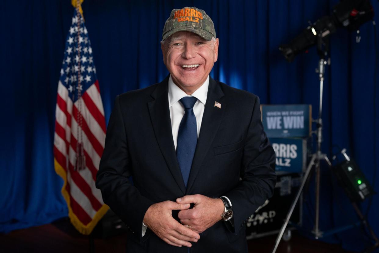 <span>Tim Walz in the camo printed hat, as posted on X.</span><span>Photograph: Tim Walz on X</span>