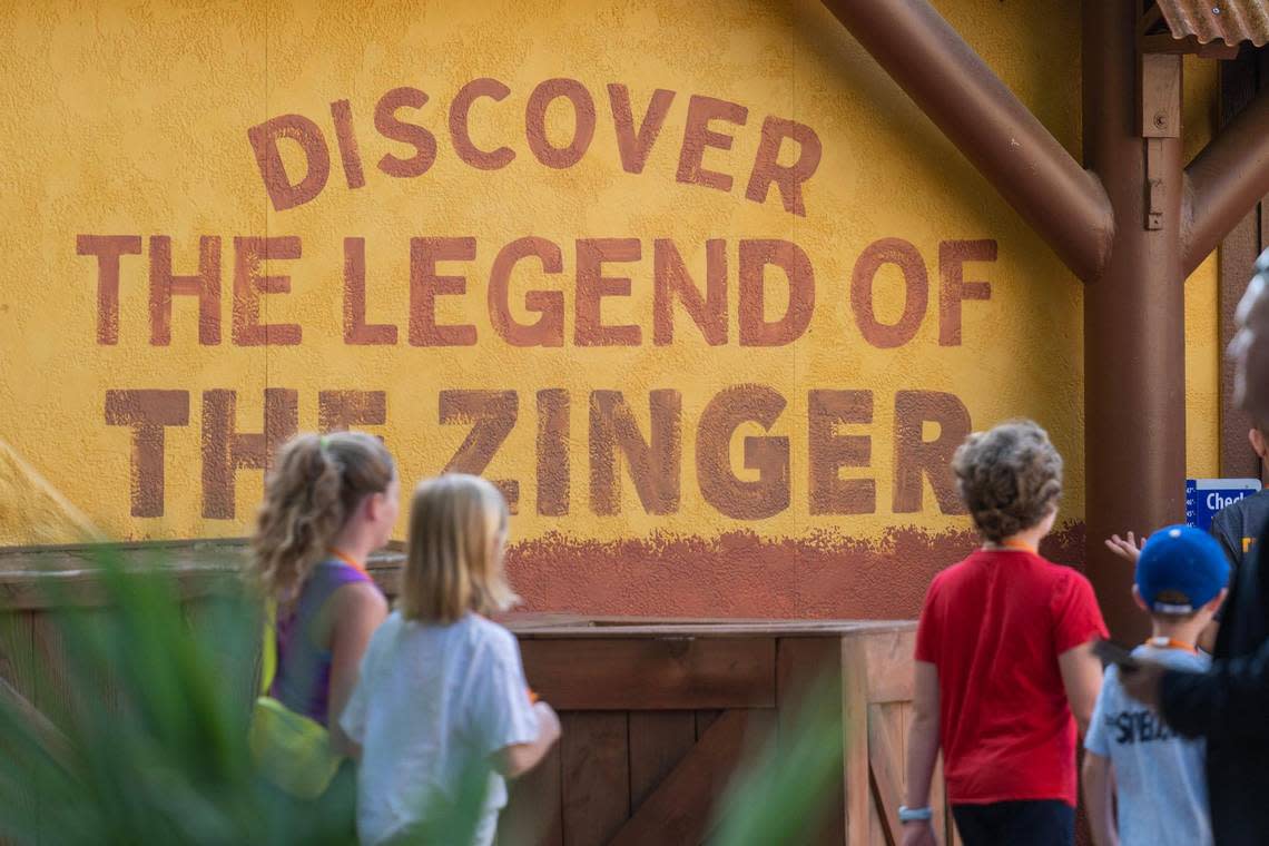 The first riders to experience the reimagined Zambezi Zinger rollercoaster make their way to the ride at Worlds of Fun on Friday, June 16, 2023, in Kansas City. Emily Curiel/ecuriel@kcstar.com