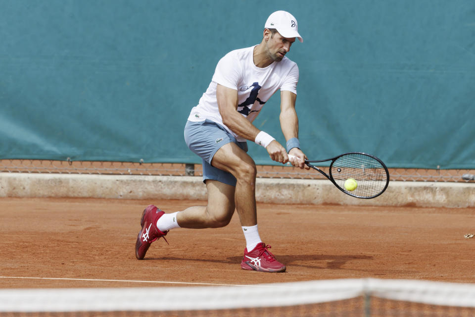 Novak Djokovic of Serbia returns a ball during a training session at the ATP 250 Geneva Open tournament in Geneva, Switzerland, Monday, May 20, 2024. (Salvatore Di Nolfi/Keystone via AP)