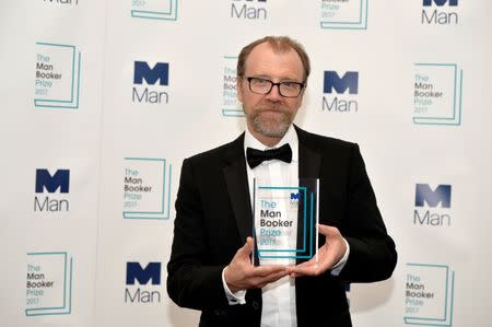 George Saunders, author of 'Lincoln in the Bardo', poses for photographers after winning the Man Booker Prize for Fiction 2017 in London, Britain, October 17, 2017. REUTERS/Mary Turner