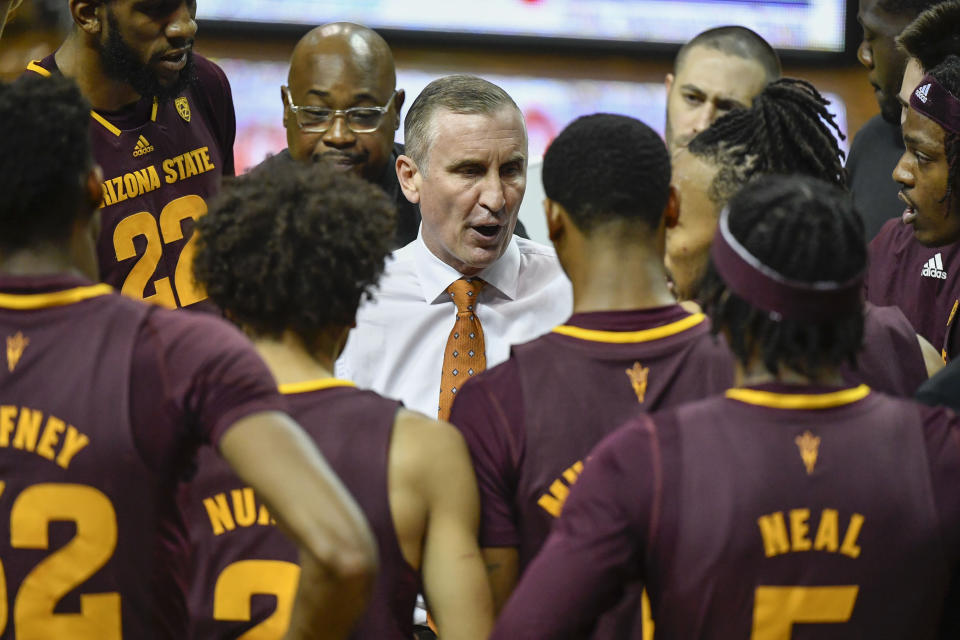 Arizona State head coach Bobby Hurley, center, talks with his players during a timeout during the first half of an NCAA college basketball game against Oregon, Thursday, Jan. 12, 2023, in Eugene, Ore. (AP Photo/Andy Nelson)