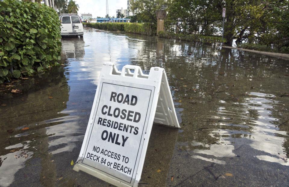 Water from the Intracoastal Waterway covers Marine Way in Delray Beach at high tide on September 28, 2019.