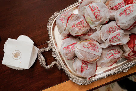 Fast food hamburgers are provided due to the partial government shutdown as the 2018 College Football Playoff National Champion Clemson Tigers are welcomed in the State Dining Room of the White House in Washington, U.S., January 14, 2019. REUTERS/Joshua Roberts