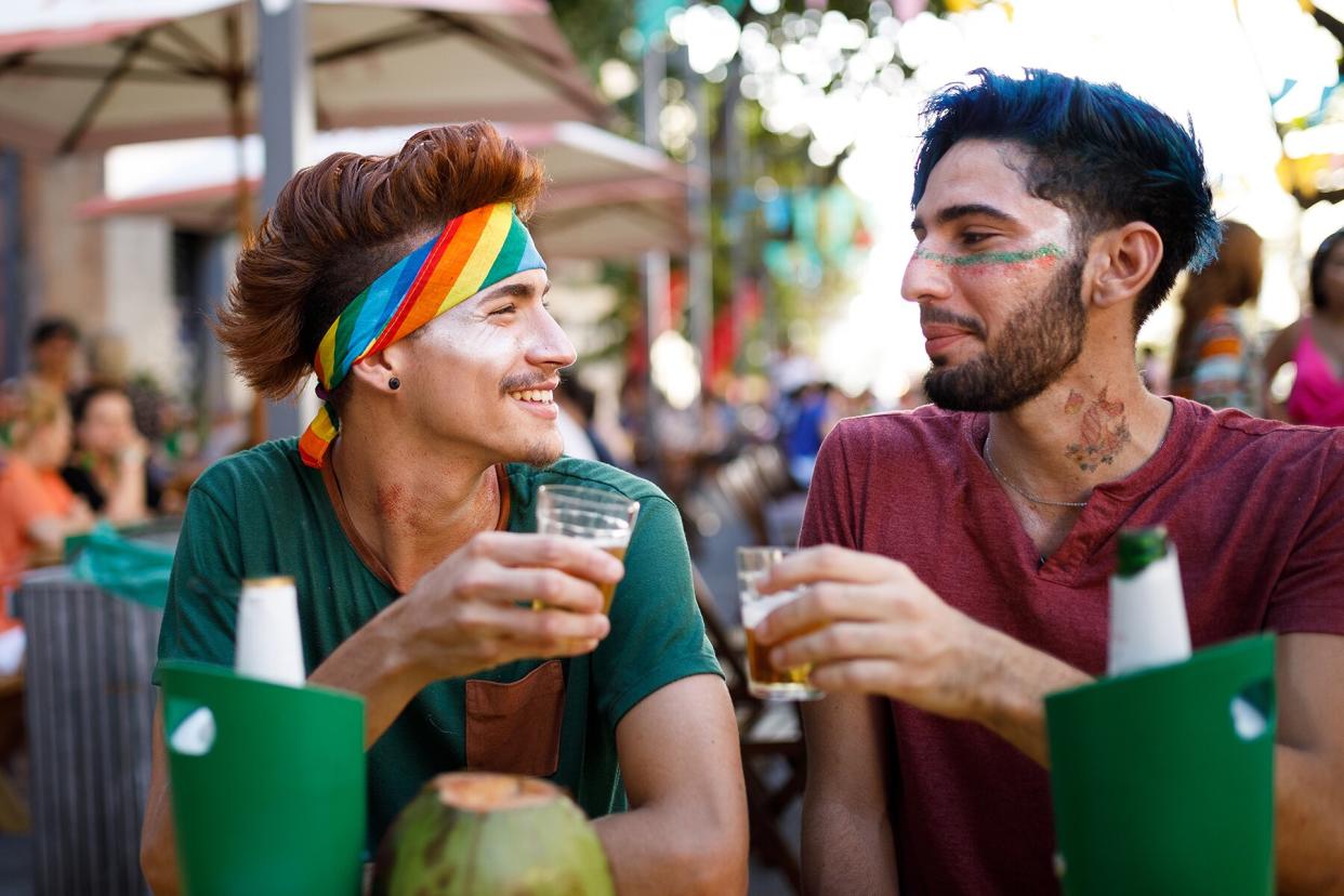 Men drinking at outdoor bar or party