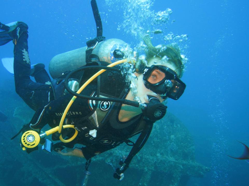 A woman seen underwater scubadiving.