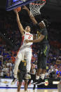 Florida guard Andrew Nembhard (2) makes a shot past Baylor forward Flo Thamba (0) during the first half of an NCAA college basketball game Saturday, Jan. 25, 2020, in Gainesville, Fla. (AP Photo/Matt Stamey)