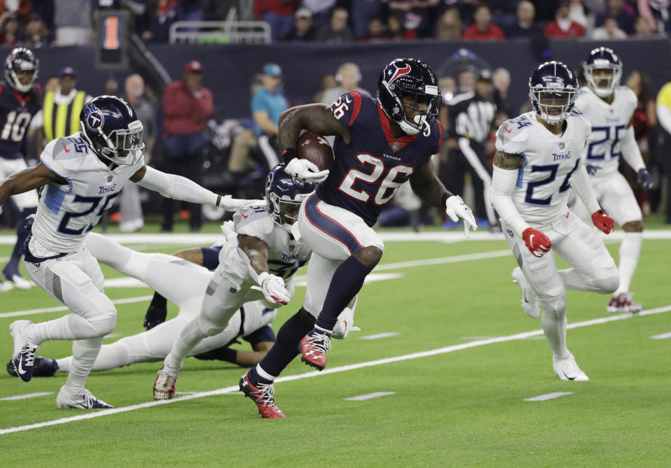 Lamar Miller made some history with his 97-yard touchdown run against the Titans. (AP)