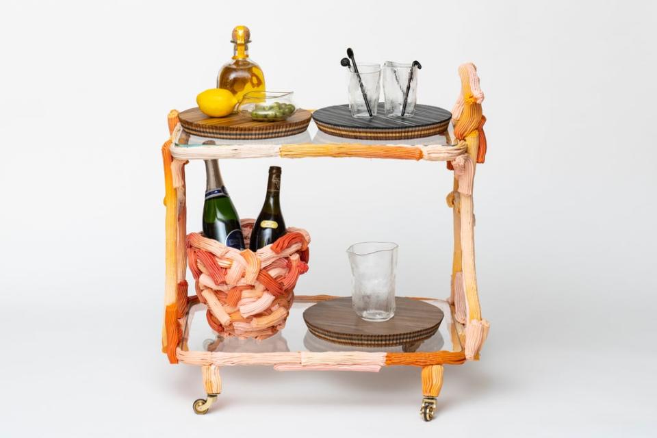 James Shaw takes brightly coloured molten plastic and turns them into drinks trolleys and other pieces (Damian Griffiths)