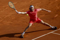 Stefanos Tsitsipas, of Greece, returns the ball against Dusan Lajovic, of Serbia, during a semi final open tennis tournament in Barcelona, Spain, Saturday, April 20, 2024. (AP Photo/Joan Monfort)