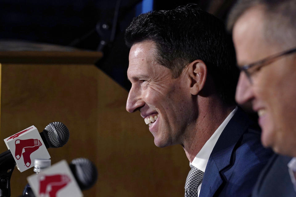 Boston Red Sox chief baseball officer Craig Breslow, left, smiles while addressing reporters while seated with team president Sam Kennedy, right, during a press availability at Fenway Park, Thursday, Nov. 2, 2023, in Boston. (AP Photo/Charles Krupa)