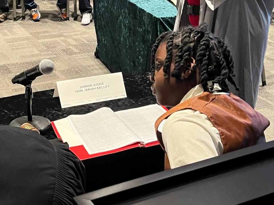 Isaiah Kelley, a fifth-grader from Oakmont Elementary, performs as a judge for a play called “Santa Claus Goes to Jail” on Friday at the Tarrant County Family Law Center in downtown Fort Worth.