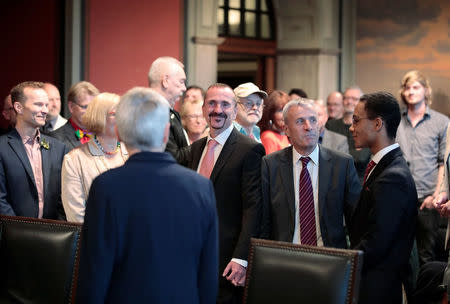 Same-sex couple Karl Kreil and Bodo Mende get married at a civil registry office, becoming Germany's first married gay couple after German parliament approved marriage equality in a historic vote this past summer, in Berlin, Germany October 1, 2017. REUTERS/Axel Schmidt