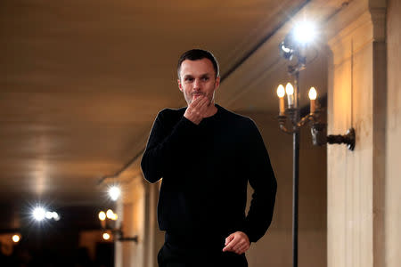 Designer Kris Van Assche appears at the end of his Fall/Winter 2019-2020 collection show for fashion house Berluti during Men's Fashion Week in Paris, France, January 18, 2019. REUTERS/Gonzalo Fuentes