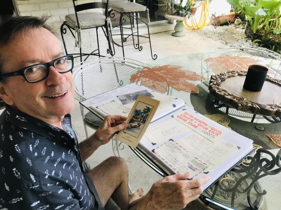 Dave Mohn, of Boca Raton, Fla., with his scrapbook of some 50 cards and letters he received from men from Lower Bucks County serving in Vietnam. As a child growing up in Lower Makefield, each Christmas between 1966 and 1970 he'd send holiday wishes to each man listed in the Bucks County Courier Times who was serving overseas.