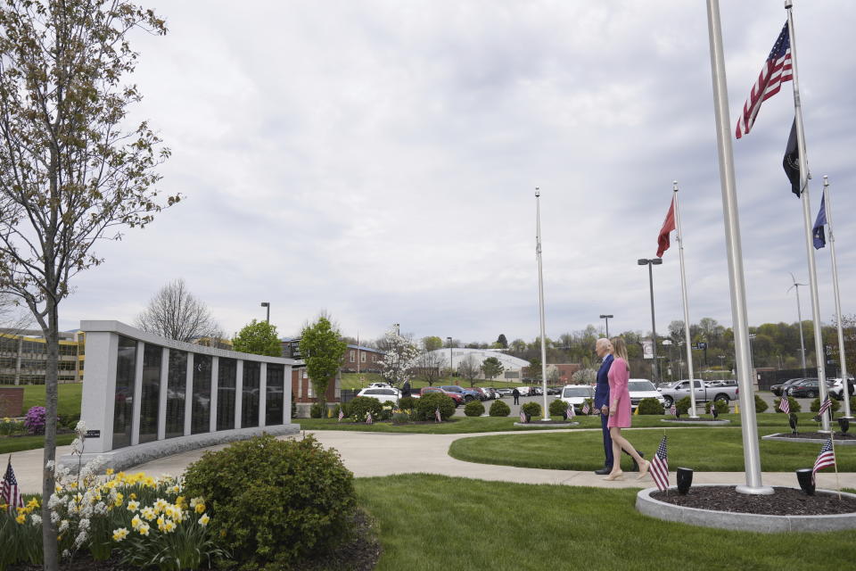 President Joe Biden visits the War Memorial in Scranton, Pa., with Scranton Mayor Paige Cognetti, right, Wednesday, April 17, 2024. Biden's uncle, Ambrose J Finnegan Jr., who died in WWII, is listed on the memorial wall. (AP Photo/Alex Brandon)