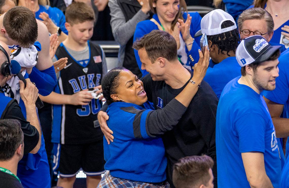 Duke coach Jon Scheyer gets a hug from Keisha Carrawell as the Blue Devils celebrate their ACC Tournament championship following their 59-49 victory over Virginia on Saturday, March 11, 2023 at the Greensboro Coliseum in Greensboro, N.C.