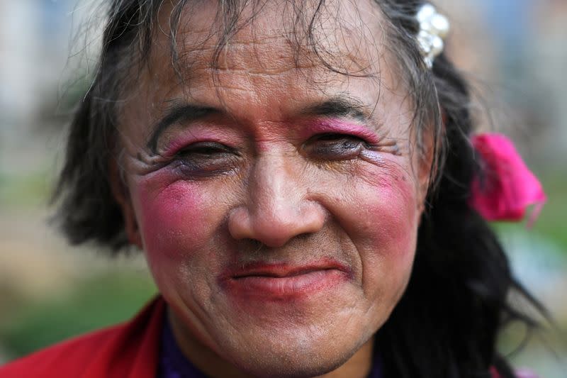 63-year-old transgender Liu Peilin poses for a picture in Guanzhong village, Fuzhou