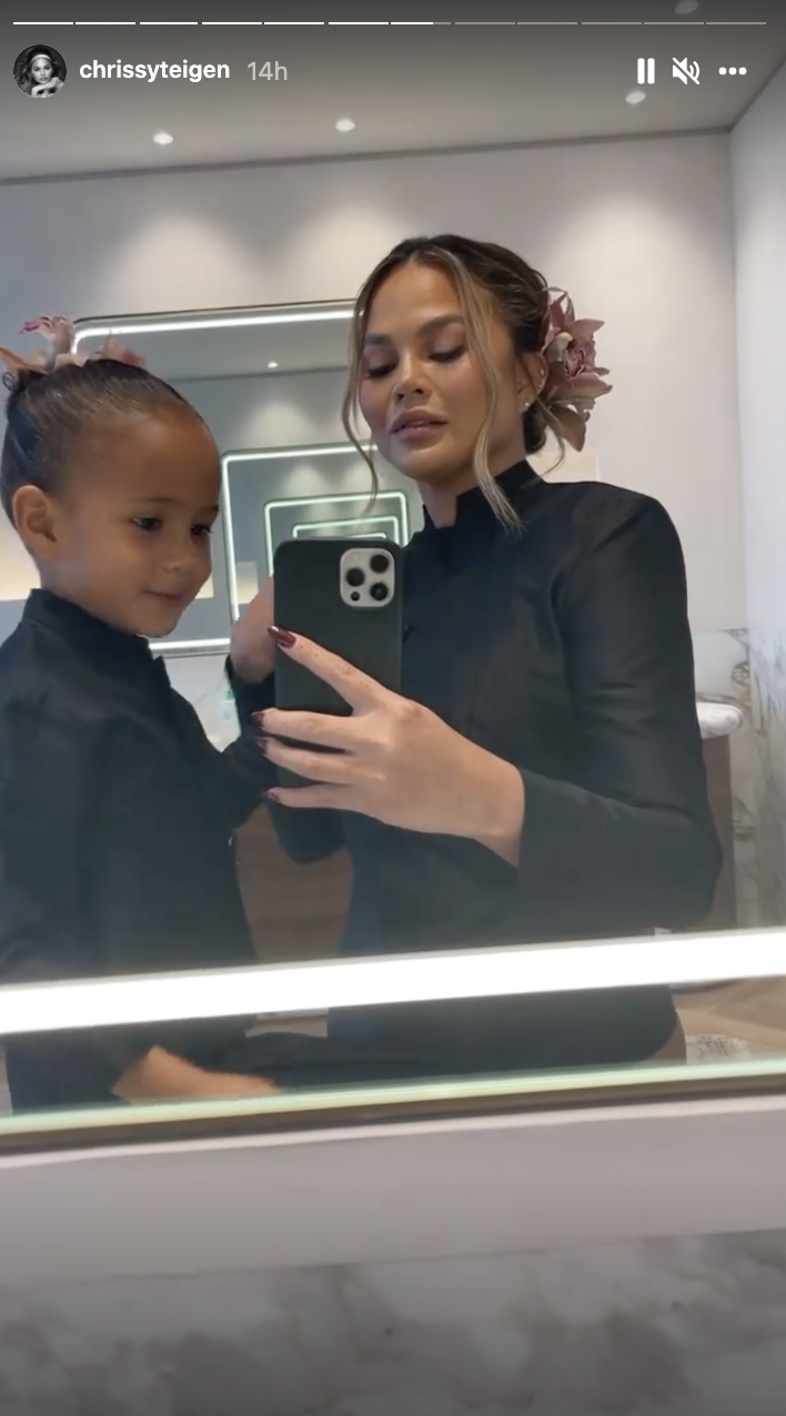 Chrissy shared a video showing her getting ready for the service with daughter Luna. (Screenshot: Chrissy Teigen via Instagram)