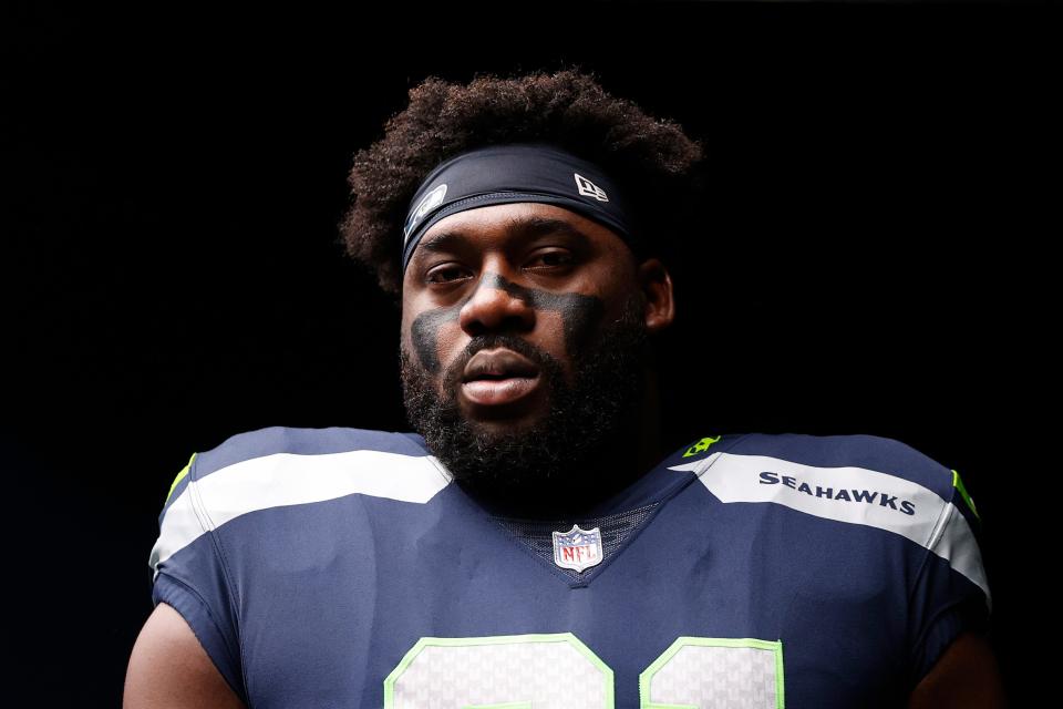 L.J. Collier #91 of the Seattle Seahawks looks on before the game against the Carolina Panthers at Lumen Field on Dec. 11, 2022, in Seattle, Washington.