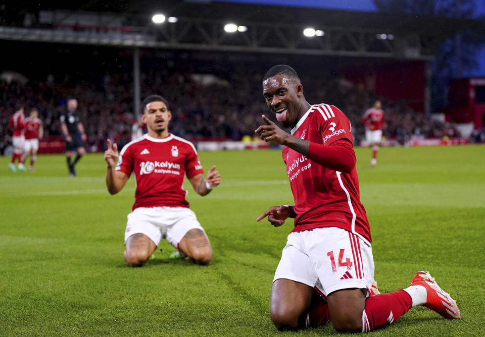 Nottingham Forest's Callum Hudson-Odoi, right, celebrates scoring the opening goal during the English Premier League soccer match between Nottingham Forest and Fulham at the City Ground, in Nottingham, England, Tuesday, April 2, 2024. (Bradley Collyer/PA via AP)