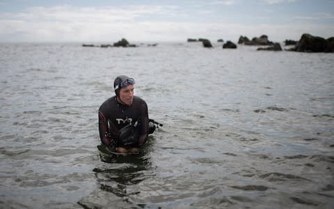 French marathon swimmer Benoit "Ben" Lecomte, takes the start of his attempt of swimming across the Pacific Ocean in Choshi - Credit: AFP