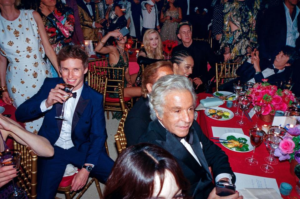 A group including Eddie Redmayne, Madonna, Jeremy Scott, Ruth Negga, Giancarlo Giametti, and Pierpaolo Piccioli observed the spectacle at the 2015 Met gala.