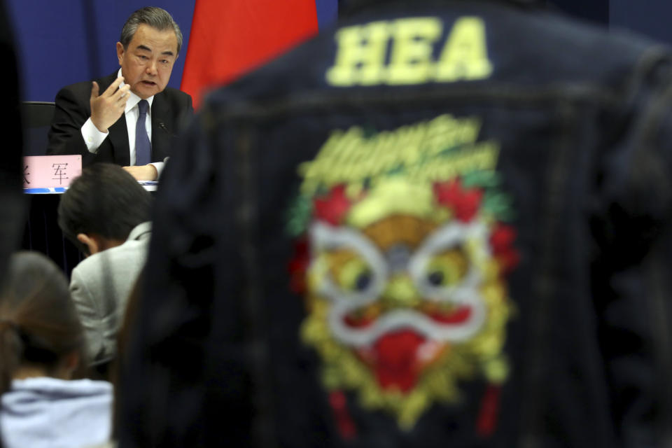 Chinese Foreign Minister Wang Yi answers media questions during a press conference on the upcoming Road and Belt Forum in Beijing on Friday, April 19, 2019. China is downplaying the political implications of its global development campaign known as the Belt and Road initiative, saying that it aims to boost multilateralism amid protectionist trends in the U.S. and elsewhere. (AP Photo/Ng Han Guan)