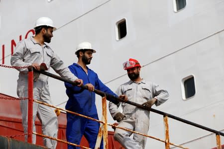 Members of the crew of the Iranian vessel Bavand are seen near the port of Paranagua