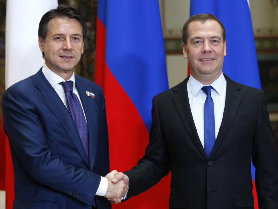 Russian Prime Minister Dmitry Medvedev, right, shakes hands with Italian Premier Giuseppe Conte during a meeting in Moscow, Russia, Wednesday, Oct. 24, 2018. Italian Prime Minister Giuseppe Conte is holding talks with Russian officials on his first trip to Moscow. (Dmitry Astakhov, Sputnik, Kremlin Pool Photo via AP)