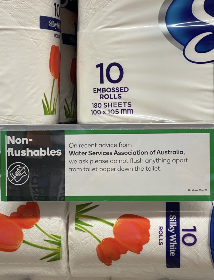 The Woolworths sign urging customers not to flush paper towels. Source: WSAA