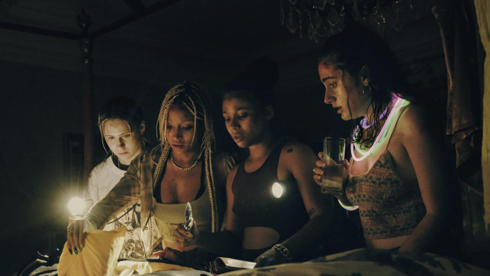 This image released by A24 shows, from left, Maria Bakalova, Amandla Stenberg, Chase Sui Wonders and Rachel Sennott in a scene from "Bodies Bodies Bodies." (A24 via AP)