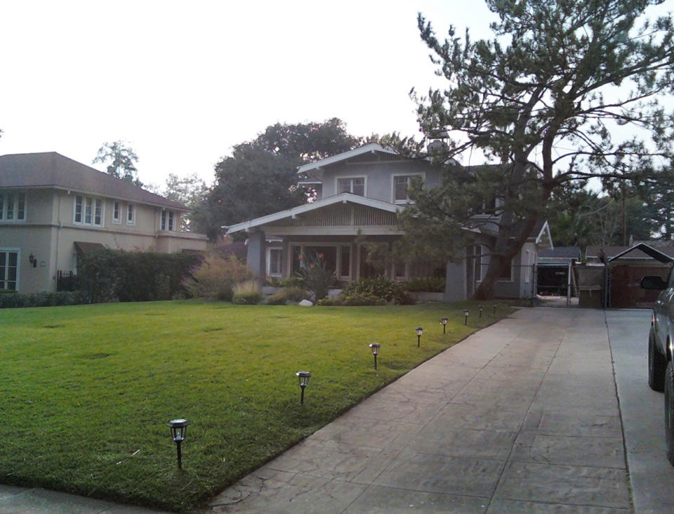 This Sept. 12, 2013 handout photo provided by David Ulick shows the original, concrete driveway that came with the 1921 Craftsman style house that Ulick bought five years ago, marred by cracks and with tree roots starting to break through, in Pasadena, Calif. (AP Photo/David Ulick, David Ulick)