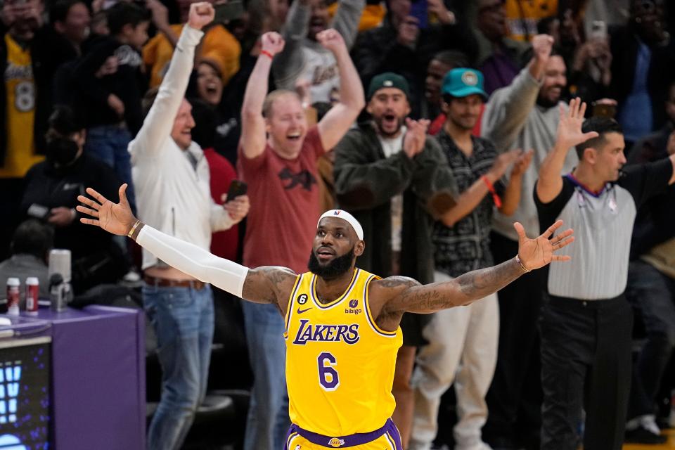 Los Angeles Lakers forward LeBron James celebrates after scoring to pass Kareem Abdul-Jabbar to become the NBA's all-time leading scorer during the second half of an NBA basketball game against the Oklahoma City Thunder Tuesday, Feb. 7, 2023, in Los Angeles.