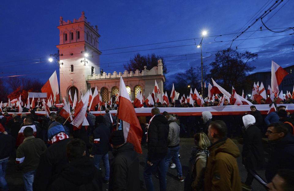 People take part in the March of Independence organized by far right activists to celebrate 101 years of Poland's independence in Warsaw, Poland, Monday, Nov. 11, 2019. (AP Photo/Czarek Sokolowski)