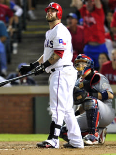 Rangers catcher Mike Napoli watches as his sixth-inning home run leaves his bat in Game 4 of the World Series