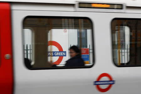 A passenger sits on an underground train leaving Parson's Green station after it reopened following an explosion on a rush hour train yesterday morning, in London, Britain, September 16, 2017. REUTERS/Peter Nicholls