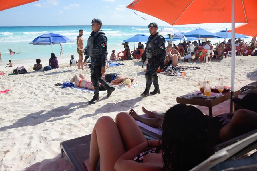 The Mexican federal police patrol a beach in Cancun, Mexico, on Jan. 18, 2017, where a shooting occurred in a nightclub the day before. (Credit: STR/AFP/Getty Images)