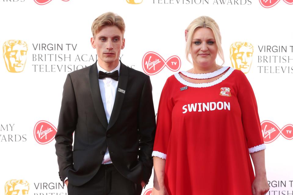 Daisy May Cooper in Swindon Town dress at the 2018 BAFTAs with brother Charlie, her This Country co-star - Credit: Ik Aldama/picture-alliance/dpa/AP Images