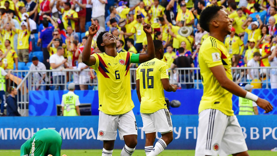 Colombia celebrate the win that sees them top Group H. Pic: Getty