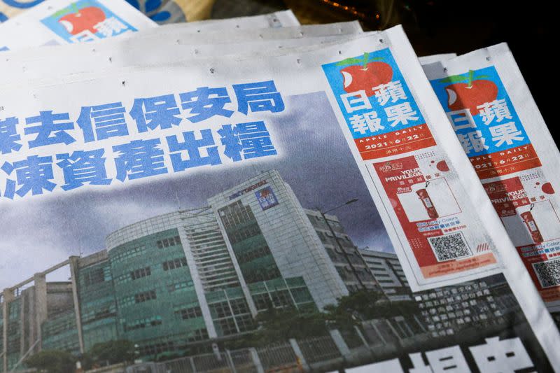 Copies of the Apple Daily newspaper are seen after it looked set to close for good by Saturday following police raids and the arrest of executives in Hong Kong