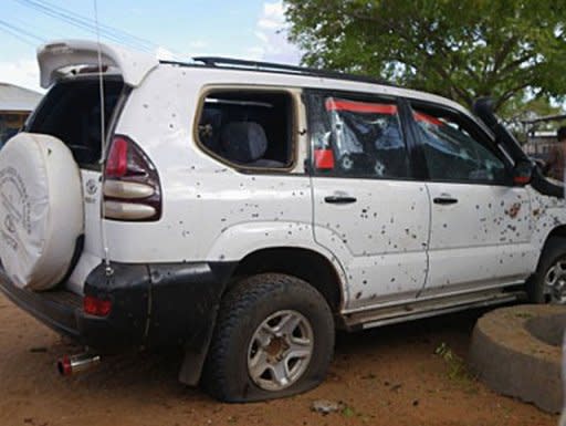 A car punctured with bullet holes is pictured after a suicide bomber blew himself up in the central Somali town of Dhusamareb. Bomb attacks in Somalia killed at least eight people including two lawmakers Tuesday, as the international community warned that peace "spoilers" threaten to wreck fragile progress in the war-torn nation