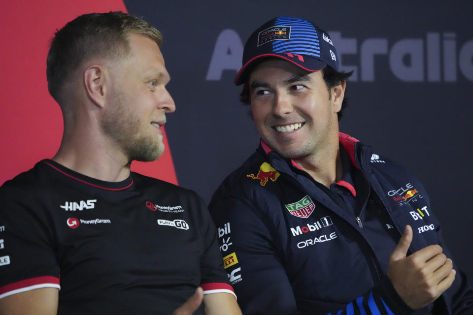 Haas driver Kevin Magnussen, left, of Denmark and Red Bull driver Sergio Perez of Mexico react during a drivers press conference ahead of the Australian Formula One Grand Prix at Albert Park, Melbourne, Australia, Thursday, March 21, 2024. (AP Photo/Asanka Brendon Ratnayake)