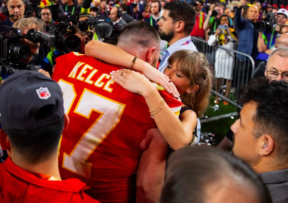 Kansas City Chiefs tight end Travis Kelce (87) celebrates with girlfriend Taylor Swift after defeating the San Francisco 49ers in Super Bowl LVIII at Allegiant Stadium.