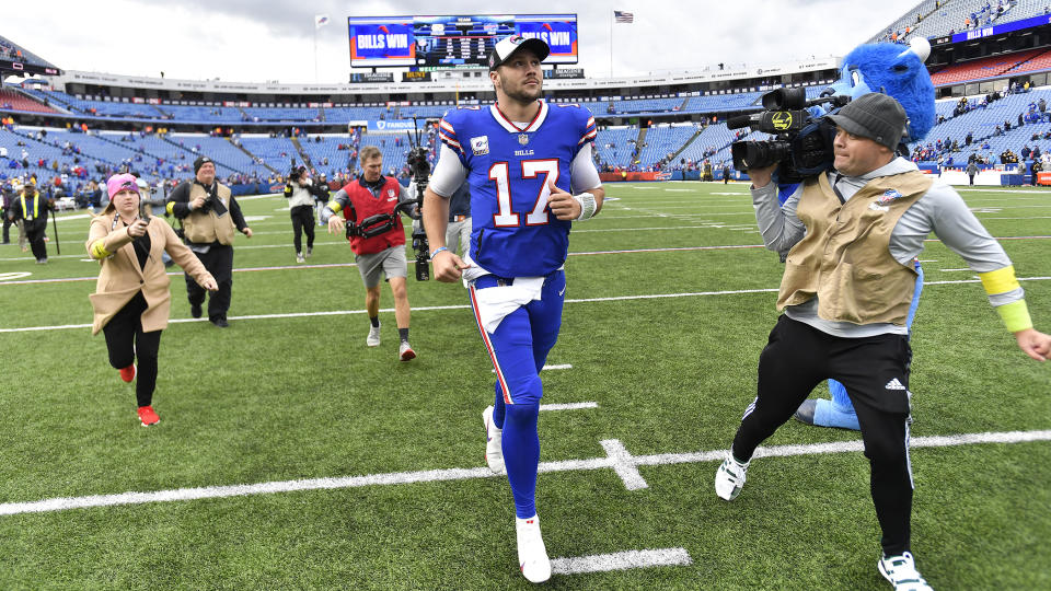 Buffalo Bills quarterback Josh Allen (17) runs off the field following an NFL football game against the Pittsburgh Steelers in Orchard Park, N.Y., Sunday, Oct. 9, 2022. The Bills won 38-3. (AP Photo/Adrian Kraus)