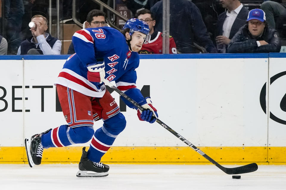 New York Rangers left wing Brennan Othmann (78) looks to pass the puck during the first period of an NHL hockey game against the Chicago Blackhawks in New York, Thursday, Jan. 4, 2024. (AP Photo/Peter K. Afriyie)