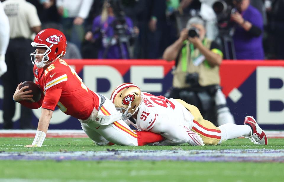 Kansas City Chiefs quarterback Patrick Mahomes is tackled by San Francisco 49ers defensive end Arik Armstead in the first half in Super Bowl LVIII at Allegiant Stadium, Feb. 11, 2024.