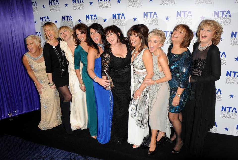 Denise Welch, Carol Mcgiffin, Kate Thornton, Andrea McClean, Zoe Tyler, Coleen Nolan, Jane McDonnald, Lisa Maxwell, Lynda Bellingham and Sherrie Hewson of the Loose Women team celebrate winning the award for Best Factual Programme, at the National Television Awards 2010. (PA Images via Getty Images)