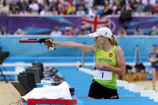 Lithuania's Laura Asadauskaite aims during the shooting event of the women's Modern Pentathlon during the 2012 London Olympics at the Equestrian venue in Greenwich Park, London