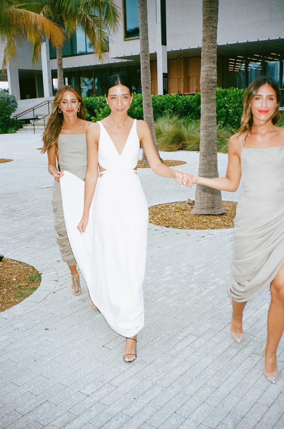 I love this photo of me and my sisters. Being the oldest I am so used to being the caretaker. They were the best matrons of honor a girl could ask for; they held my hand and train every step of the way. Also they looked so amazing in their La Bomba Jacquemus dresses.