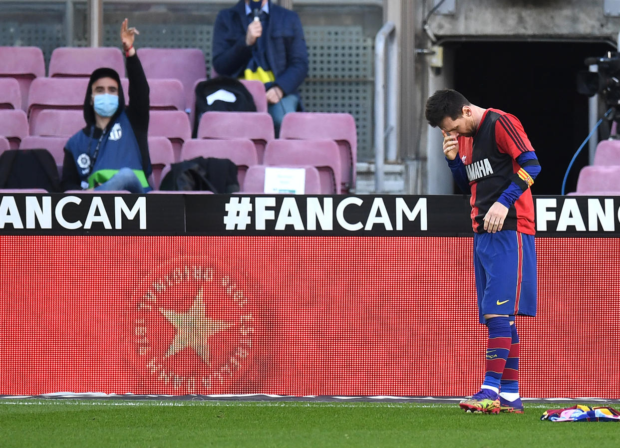 BARCELONA, SPAIN - NOVEMBER 29: Lionel Messi of Barcelona reacts after scoring their sides fourth goal while wearing a Newell's Old Boys shirt with the number 10 on the back in memory of former footballer, Diego Maradona, who recently passed away during the La Liga Santander match between FC Barcelona and C.A. Osasuna at Camp Nou on November 29, 2020 in Barcelona, Spain. Sporting stadiums around Spain remain under strict restrictions due to the Coronavirus Pandemic as Government social distancing laws prohibit fans inside venues resulting in games being played behind closed doors. (Photo by David Ramos/Getty Images)